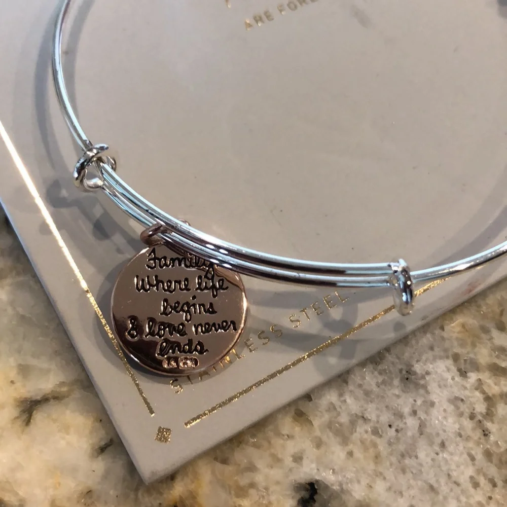 new Silver-finish bracelet with a sleek wire design and 3 hanging charms